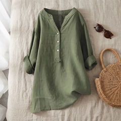 Veronique blouse in green styled as a flat lay with summer accessories