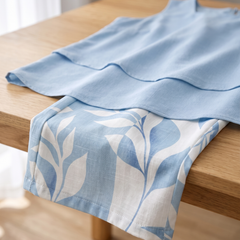 Close-up of the botanical print fabric and layered top of the Sky Blossom Set