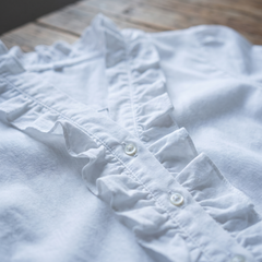 Isadora blouse ruffle and button detail close-up