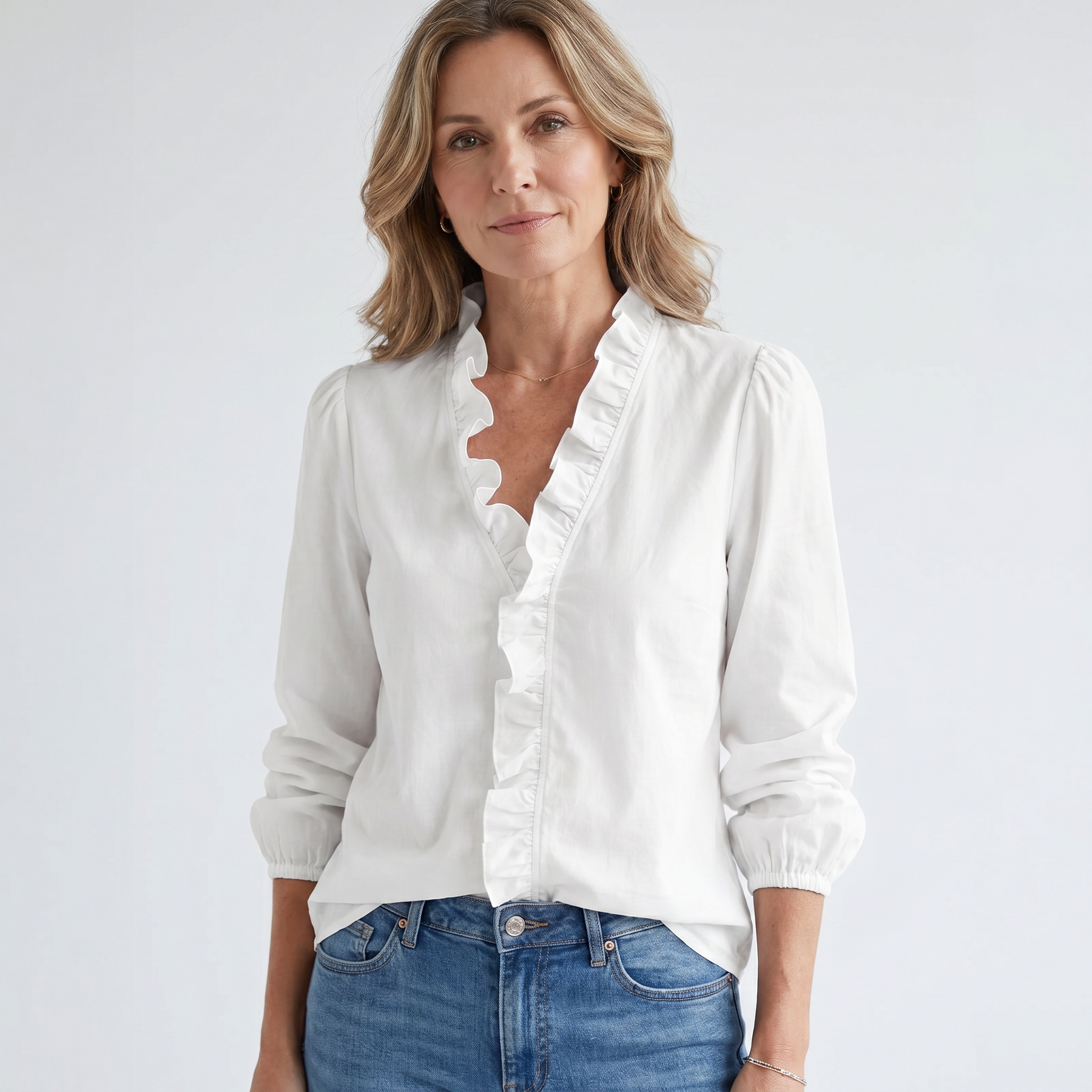 Isadora white ruffled blouse on model