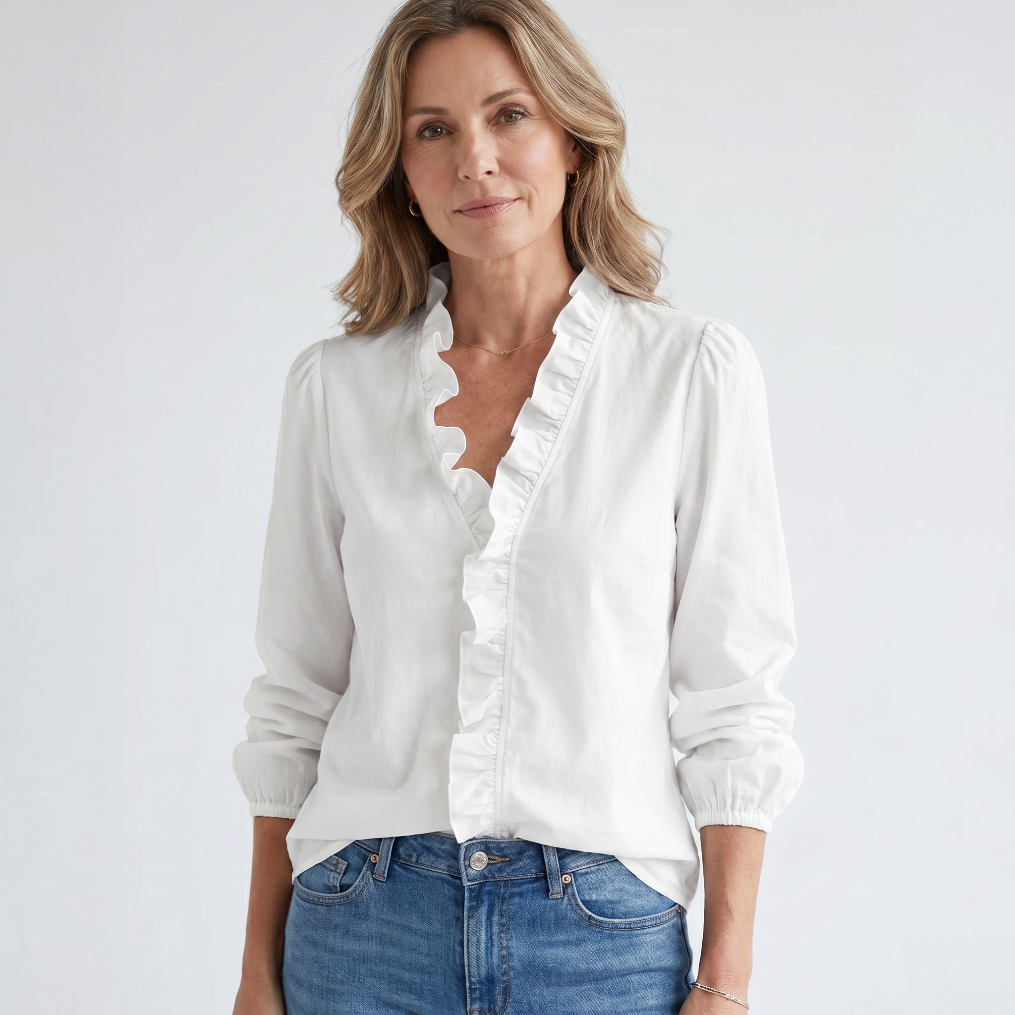 Isadora white ruffled blouse on model