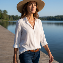 Woman wearing Natalie Elegant Blouse on a waterfront boardwalk